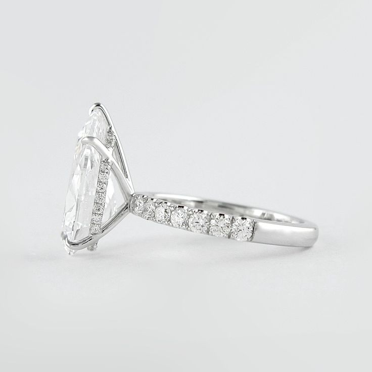 an oval cut diamond ring with side stones