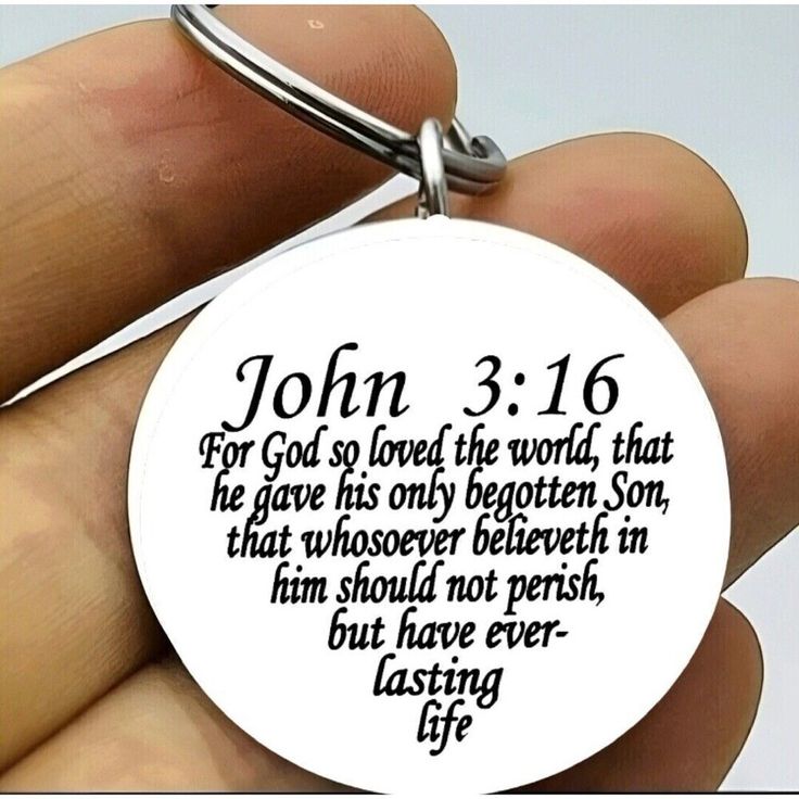 a hand holding a keychain with the words john 3 16 written on it