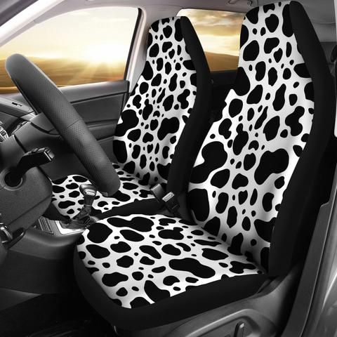 the interior of a car with black and white animal print on it's seat covers