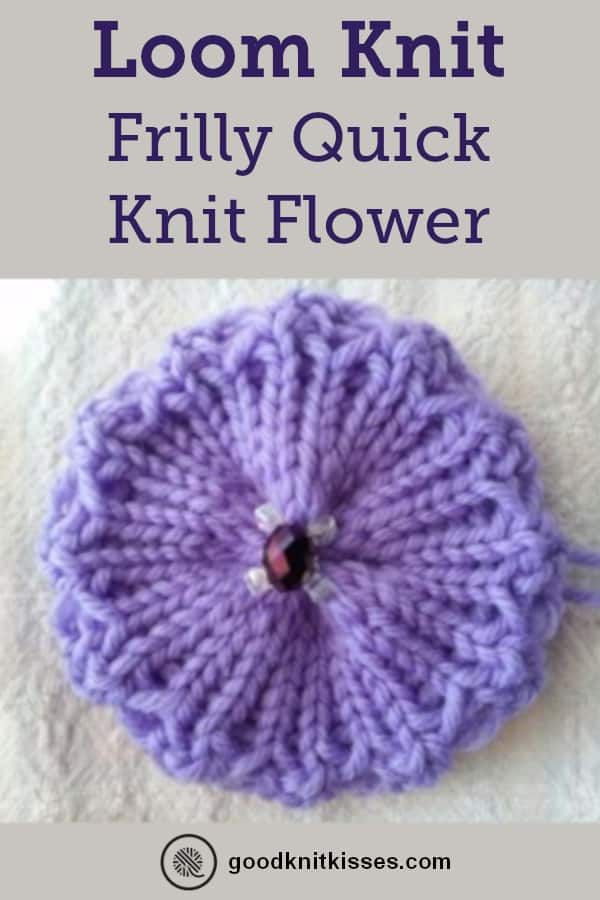 a knitted flower sitting on top of a white blanket with text overlay that reads loom knit frilly quick knitt flower