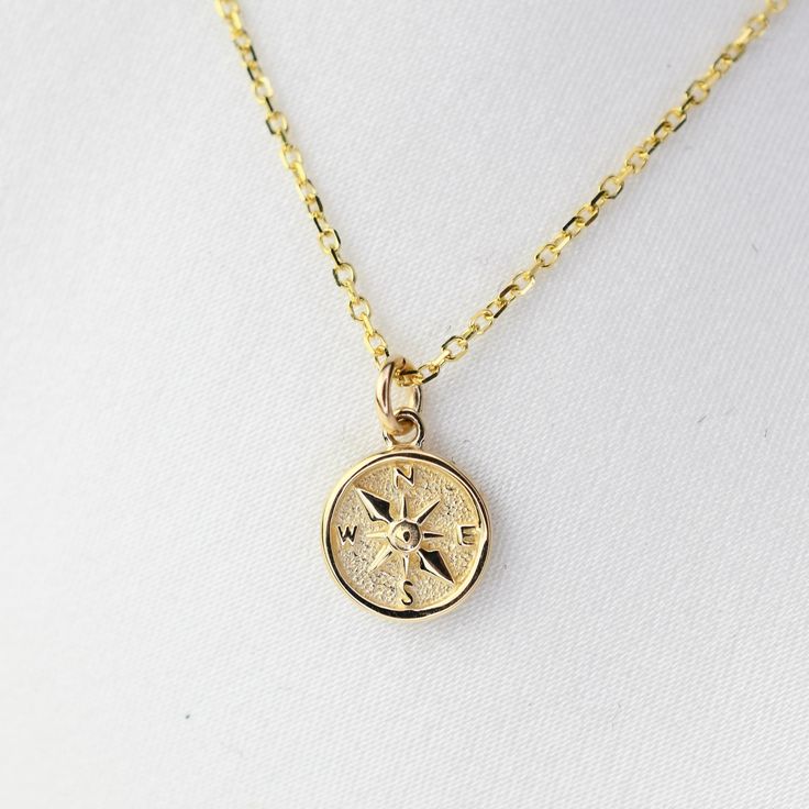 "14K Gold North Star Charm Necklace. 14k gold compass necklace, Graduation gift, Travel necklace This necklace is adjustable to 16\", 17\" or 18\" lengths.  ★ The necklace is 14K solid gold.  ★ 14K gold North Star Charm is tiny, it is about 7mm." Second Star Necklace, Minimalist Gold Compass Design Jewelry, Gold Minimalist Compass Design Jewelry, Travel Yellow Gold Jewelry With Compass Design, Elegant Gold Necklace With Compass Design, Gold Vintage Necklace With Compass Design, Yellow Gold Charm Necklace With Compass Design, Gold Charm Necklace With Compass Design, Gold Compass Design Necklace For Travel