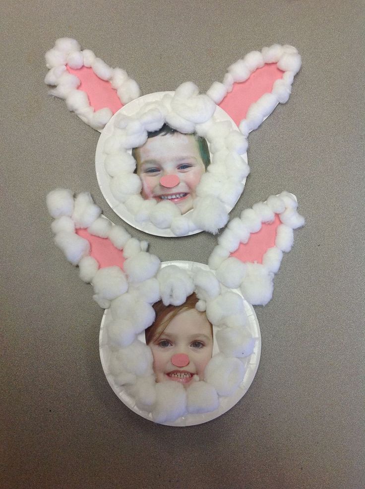 two plates with bunny ears on them and one has a child's face in the center