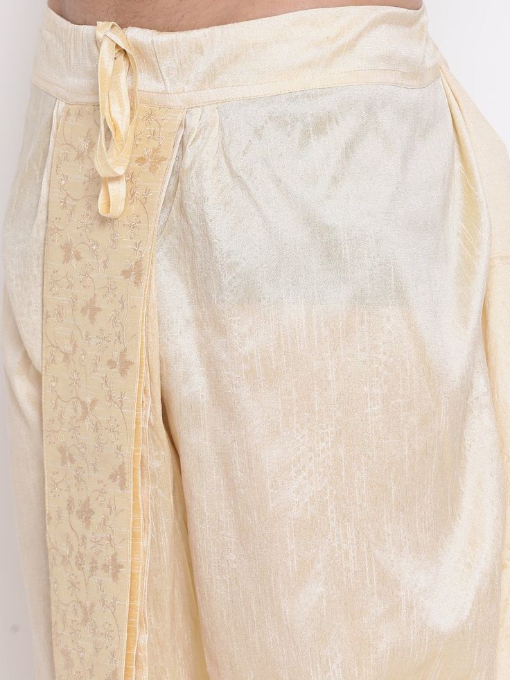 VM By VASTRAMAY Men's Gold Embroidered Dhoti Pant The VM By VASTRAMAY Men's Gold Embroidered Dhoti Pant is a perfect blend of traditional aesthetics and modern comfort. Designed with intricate embroidery, this dhoti pant is ideal for festive occasions, weddings, and cultural events. The luxurious gold hue adds a regal touch to your attire, making you stand out in any crowd. Key Features Elegant gold color with intricate embroidery Comfortable fit for all-day wear Perfect for festive and cultural Traditional Zari Work Sets With Straight Pants, Traditional Wedding Pants With Embroidered Border, Festive Wedding Pants With Embroidered Border, Traditional Straight Pants With Zari Work, Traditional Festive Sets With Straight Pants, Unstitched Traditional Sets With Straight Pants, Traditional Kurta With Dupatta And Straight Pants, Traditional Navratri Sets With Straight Pants, Festive Pants With Traditional Drape For Eid