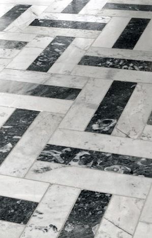 a black and white tiled floor in a room