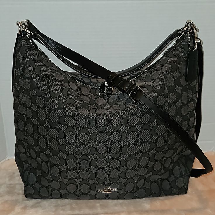 This Is In Excellent Condition. Very Minor Wear On Material... Coach Shoulder Bag With Gunmetal Hardware For On-the-go, Gray Crossbody Bag With Leather Handles, Coach Gray Shoulder Bag, Gray Bags With Detachable Strap For On-the-go, Gray Shoulder Bag With Gunmetal Hardware, Gray Bag With Detachable Strap For On-the-go, Gray On-the-go Bag With Detachable Strap, Coach Black Crossbody Hobo Bag, Coach Gray Shoulder Bag For Shopping