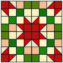 a red, green and white quilt with a star in the center on it's side