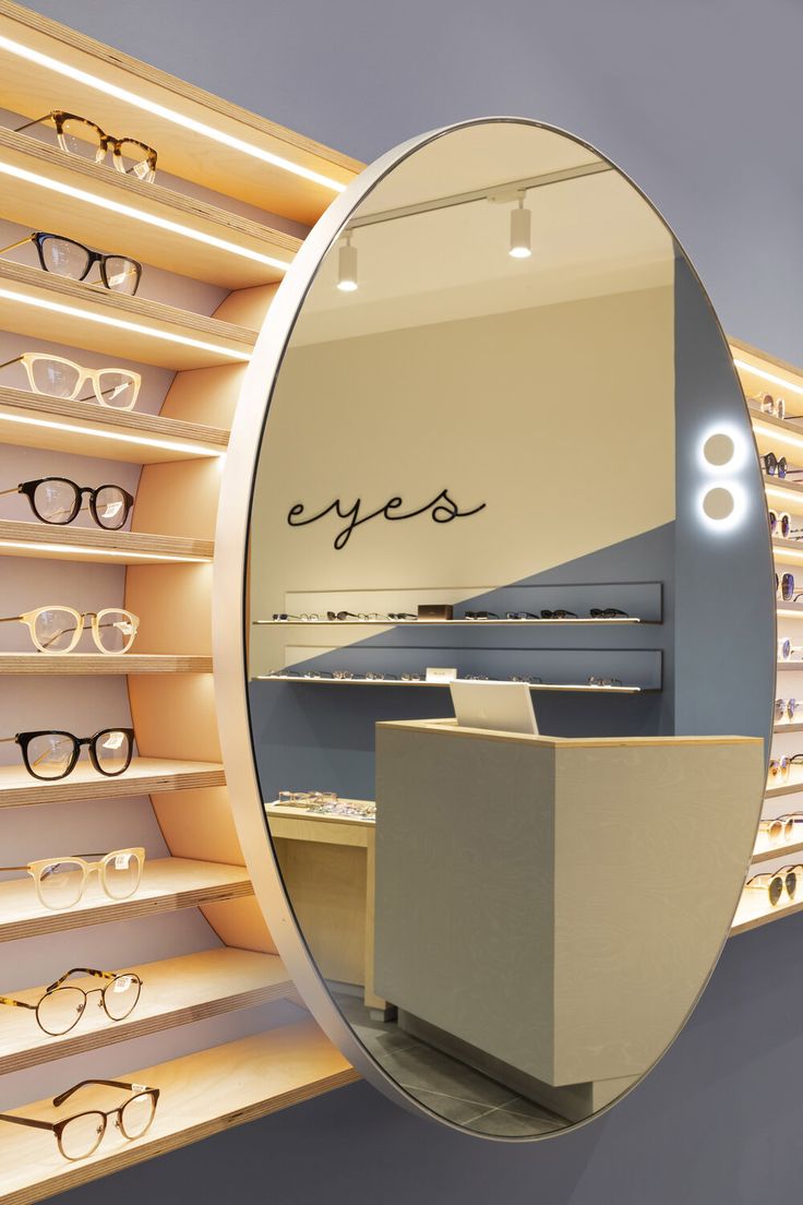 a pair of glasses are on display in front of a store's eyeglasses