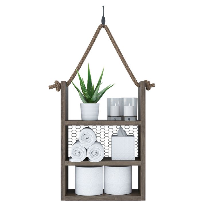 a shelf with towels, toiletries and plants hanging from it's sides on a white background