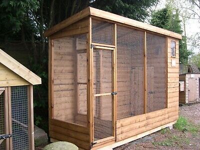 a chicken coop in the middle of a yard