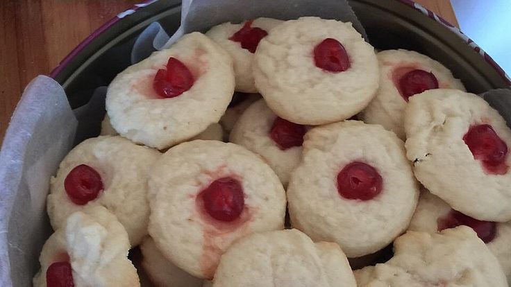 a bowl filled with cookies covered in jelly