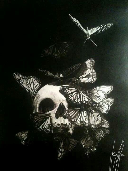 there is a skull with butterflies on it