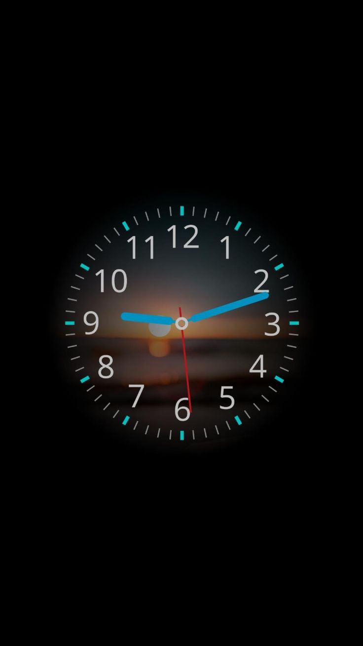 an illuminated clock showing the time at 11 00