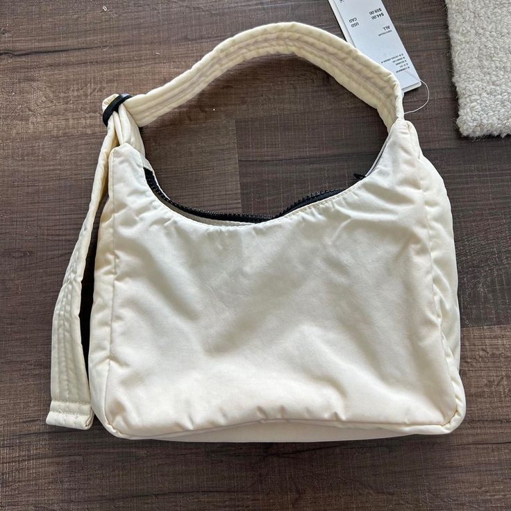 Questions? Leave A Comment Below! White Hobo Bag With Adjustable Handle For Everyday, Cream Baguette Bag With Double Handle For Everyday, Casual Cream Baguette Bag For Daily Use, Casual Cream Baguette Bag For Everyday, Casual Cream Baguette Shoulder Bag, Casual Cream Shoulder Baguette Bag, Everyday Beige Baguette Bag With Zipper Closure, White Canvas Hobo Bag For Errands, Casual Beige Baguette Bag For Errands