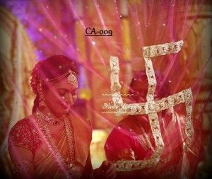 a woman in a red sari and gold jewelry