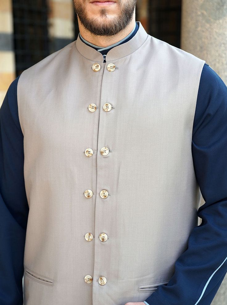 Open mandarin collar Full buttoned opening Faux line of buttons 2 front welt pockets Angled lower opening Model is 184cm (6 feet) and wearing size L Item Code: mW1201 Semi-formal Nehru Jacket With Long Sleeves, Formal Nehru Jacket With Stand Collar And Button Closure, Semi-formal Long Sleeve Nehru Jacket With Buttons, Long Sleeve Nehru Jacket With Buttons For Semi-formal Occasions, Semi-formal Nehru Jacket With Stand Collar, Classic Semi-formal Nehru Jacket With Button Closure, Fitted Bandhgala With Stand Collar And Button Closure, Fitted Bandhgala With Button Closure And Stand Collar, Fitted Nehru Jacket With Stand Collar And Pockets