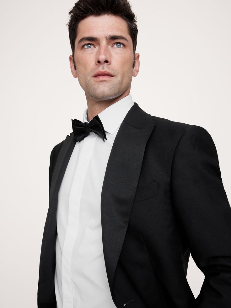 This timeless tuxedo shirt has a cutaway collar and traditional French cuffs with linked buttons so you can replace with cuff links if you like.  Slim fit.  Cutaway collar.  Long sleeves with French cuffs.  Concealed button placket.  Shirttail hem.  Slim fit.  Long sleeves.  Hip length.  Model: Size M, 6'2" (188cm). Classic Formal Blazer With Fold Down Collar, Elegant Tuxedo For Black Tie With Hidden Buttons, Classic Formal Tuxedo With Hidden Button Closure, Professional Tuxedo For Black-tie Events With Suit Collar, Classic Single-breasted Tuxedo For Black Tie, Classic Long Sleeve Suits For Black Tie Event, Classic Black Tie Suits With Long Sleeves, Elegant Single Breasted Blazer With Fold Down Collar, Timeless Long Sleeve Wedding Tuxedo