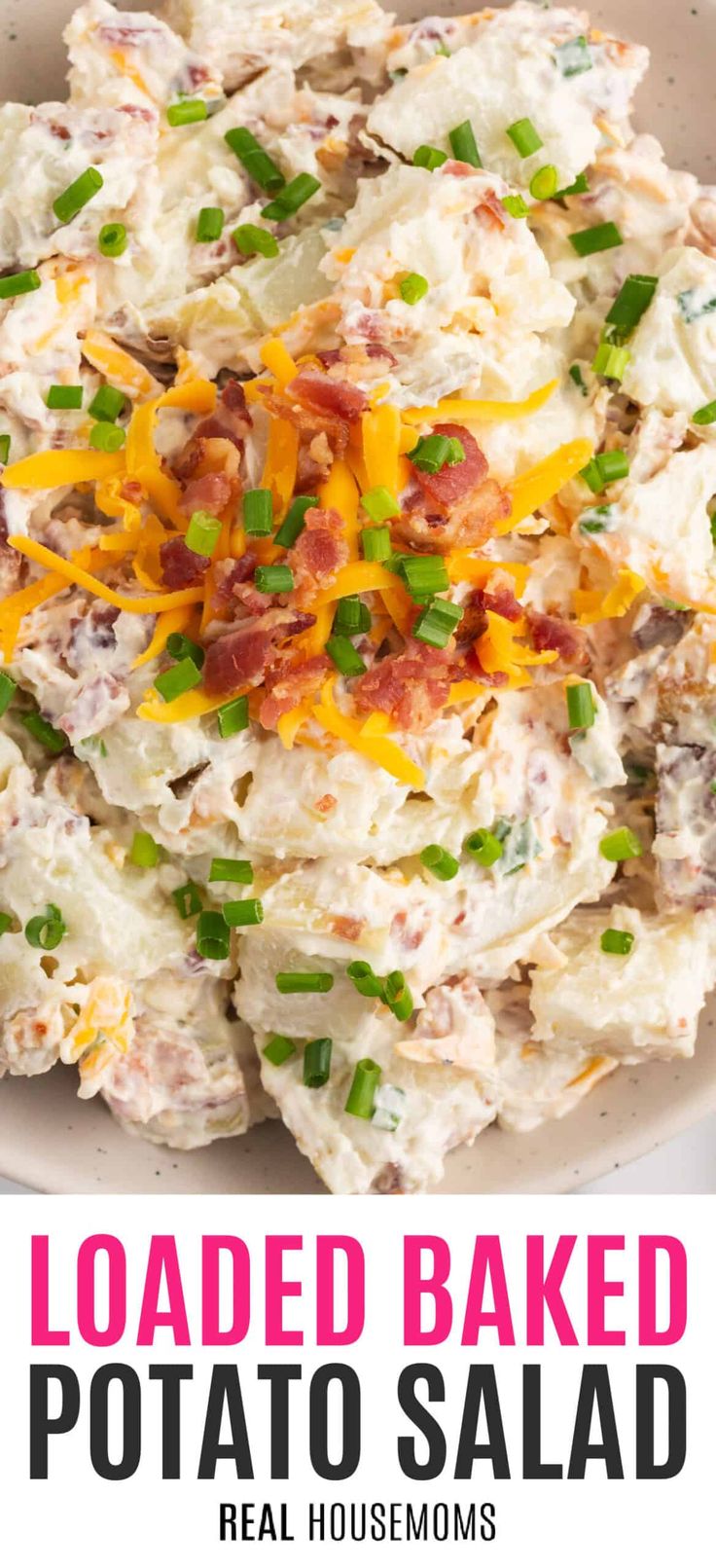 loaded baked potato salad in a white bowl