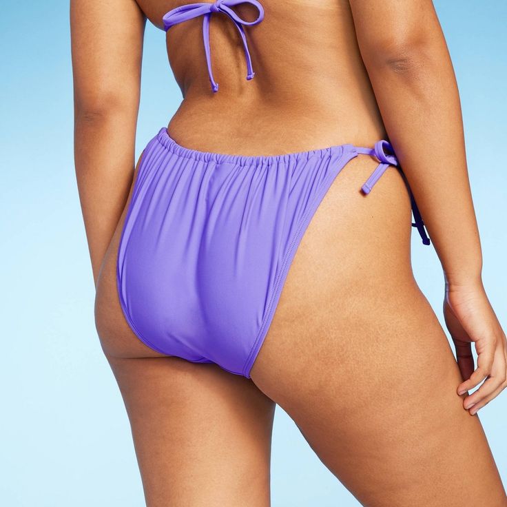 Scoop-front bikini bottom from Wild Fable™ in a solid hue. Made from soft fabric with spandex and full lining for flexible comfort in and out of the water. Tailored in a low-rise, high-leg silhouette. Side string ties complete the look with a customizable fit and coverage. If you’re not satisfied with any Target Owned Brand item, return it within one year with a receipt for an exchange or a refund. Wild Fable™: A look for every story. Seamless Nylon Swimwear With Tie-side Bottom, Seamless Nylon Tie-side Swimwear, Beach Season Tankini With Tie-side Bottom, Nylon Tankini With Tie-side Bottom For Sunbathing, Stretch Tankini With Tie-side Bottom For Sunbathing, Nylon Tankini For Sunbathing With Tie-side Bottom, Nylon Tie-side Tankini For Sunbathing, Solid Seamless Tie-side Swimwear Bottom, Solid Color Seamless Swimwear With Tie-side Bottom