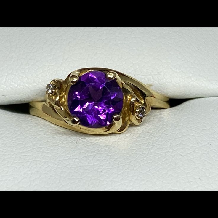 New Without Tags Breathtaking Amethyst Set In A 14k Yellow Gold Setting. Amethyst Flashes All Colors Of Pinks And Purples And Is Flanked On Either Side By Two Diamonds. See Video. Amethyst Is Approximately 1.25 Carats. Diamonds Are Approximately .06 Carats. Ring Is A Size 5.75. New Never Worn. 5 Star Seller, See My Love Notes. Luxury Yellow Gold Amethyst Ring For Women, Elegant Faceted Amethyst Ring In Yellow Gold, Collectible 14k Yellow Gold Amethyst Ring, Luxury Yellow Gold Amethyst Ring Collectible, 14k Gold Multi-stone Purple Amethyst Ring, Amethyst Set, Gold Rings Fashion, Book Jewelry, Yellow Gold Setting