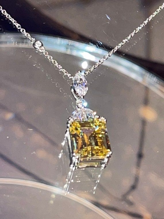 Check out this item in my Etsy shop https://www.etsy.com/listing/1382279074/emerald-cut-fancy-yellow-necklace Formal Yellow Necklace With Brilliant Cut, Luxury Yellow Necklace With Brilliant Cut, Luxury Yellow Necklaces For Formal Occasions, Luxury Yellow Necklaces For Anniversary, Luxury Yellow Cubic Zirconia Necklaces, Yellow Diamond-cut Necklace In Fine Jewelry Style, Yellow Diamond Cut Necklace In Fine Jewelry Style, Formal Yellow Hallmarked Necklace, Elegant Yellow Pendant Jewelry