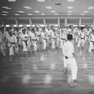 black and white photo of people in karate uniforms