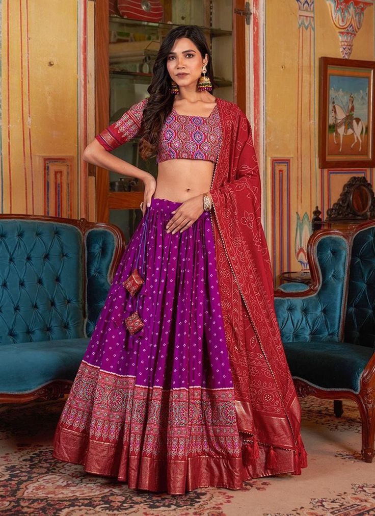 Transform into a whimsical princess with our Purple Bandhani Dola Silk Ajarakh Printed Lehenga Choli. Perfect for weddings and bridesmaids, this readymade Indian outfit boasts intricate details and vibrant colors. Stand out in a sea of traditional outfits and make a statement with this playful and unique ensemble! The unstitched blouse can be customized upto 46 inches. Do Note: All the accessories shown are for styling purpose only. Slight color variation may occur due to photographic reasons. O Bridesmaid Indian Outfits, Bridesmaids Indian, Indian Wedding Lehengas, Bridesmaid Indian, Elegant Lehenga, Ghaghra Choli, Bandhani Print, Lehenga Choli For Women, Choli For Women