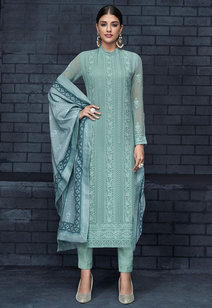 Semi-stitched Faux Georgette Pakistani Suit in Pastel Blue This Band Collar Neck and Full Sleeve attire with Poly Shantoon Lining is Prettified with Abstract Print, Resham and Patch Border Work Available with a Pastel Blue Poly Shantoon Pant and a Pastel Blue Art Muslin Silk Dupatta The Kameez and Bottom Lengths are 43 and 38 inches respectively Do note: The Length may vary upto 2 inches. Accessories shown in the image are for presentation purposes only.(Slight variation in actual color vs. ima Orang India, Celana Fashion, Indian Salwar, Kameez Designs, Salwar Designs, Gaun Fashion, Long Kurti Designs, Salwar Kamiz, Kurti Designs Party Wear