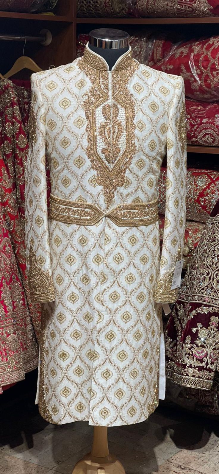 Mesmerize the crowd by your magnificent gaze in this off white pure raw silk fabricated wedding sherwani crafted in zardosi,bead,stone,resham & zari work with details embroidered waist belt. Available with matching bottoms chudidar. Size: 38,44 Ready to Ship! Embroidered Sherwani, Ceremonial Clothing, Wedding Sherwani, Zari Work, Extra Fabric, Churidar, Sherwani, Wedding Looks, Raw Silk