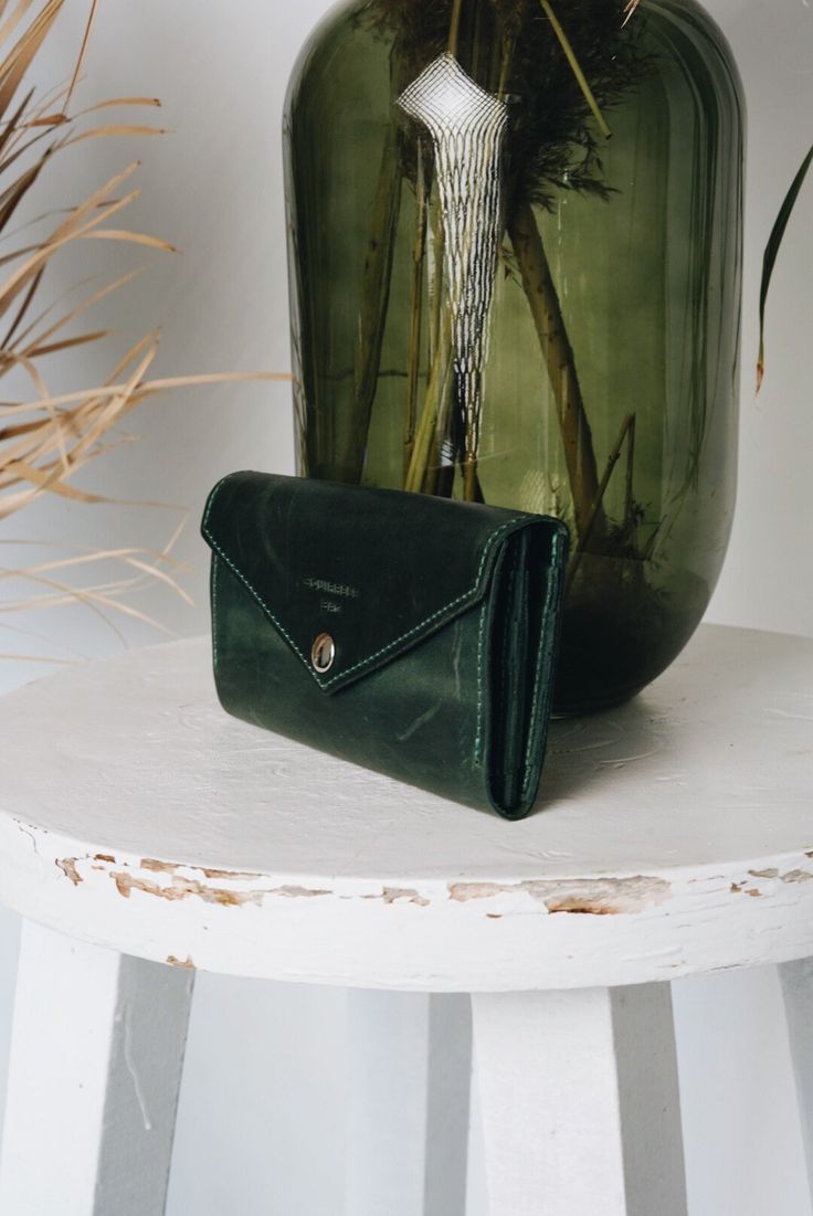 "A lovely, deep green women's wallet handmade from high quality leather. This beautiful, bright wallet will attract money with its lucious color :) It is long, so that you don't have to fold your money. It has a zipper section in the middle, for wallet mice and loose change. The button at the front will keep it securely locked. A special credit card section will hod 12 cards. Please, choose your color at the left pane, according to the attached and numbered photo. PLEASE, ALLOW US 5-7 DAYS TO FI Modern Handmade Wallets As Gifts, Modern Handmade Wallets For Gifts, Green Leather Wallet As Gift, Green Trifold Wallet With Interior Card Slots As Gift, Green Trifold Wallet For Everyday Use, Green Trifold Wallet With Card Slots As Gift, Green Trifold Wallet For Daily Use, Everyday Green Trifold Wallet, Green Leather Coin Purse For Gift