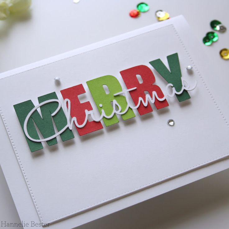 a handmade christmas card with the word merry written in red, green and white