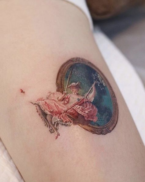 a woman's arm with a tattoo on it that has an image of a ballerina