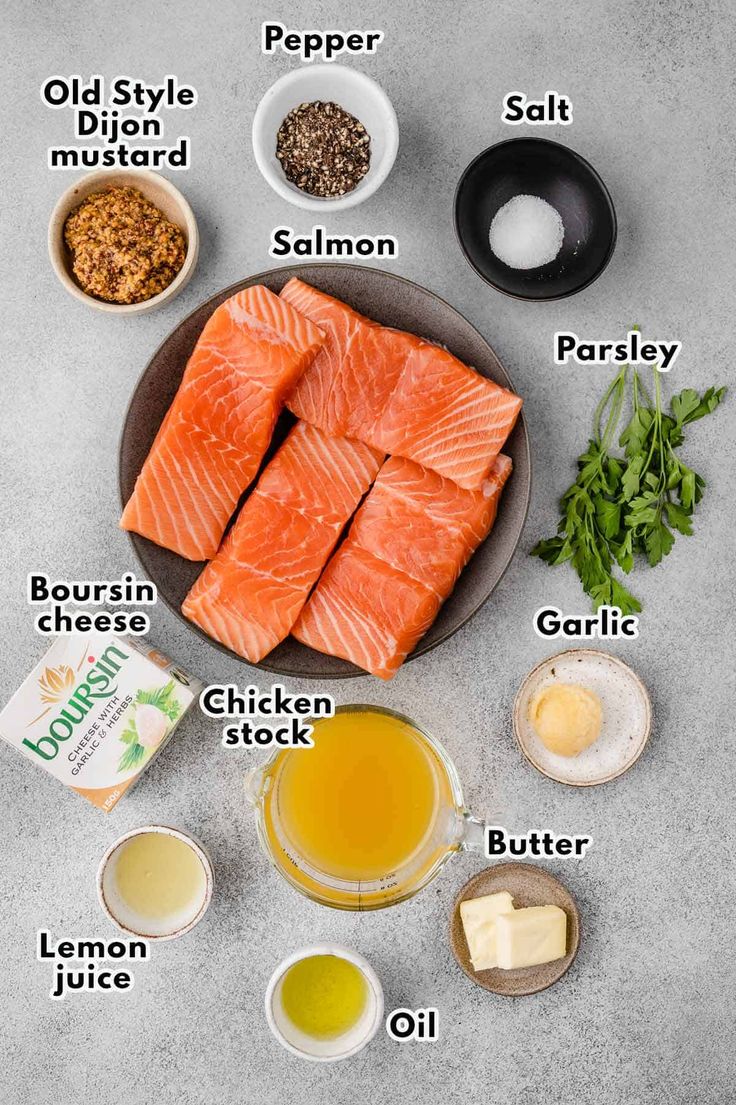 ingredients to make salmon soup laid out on a gray surface with the names in english