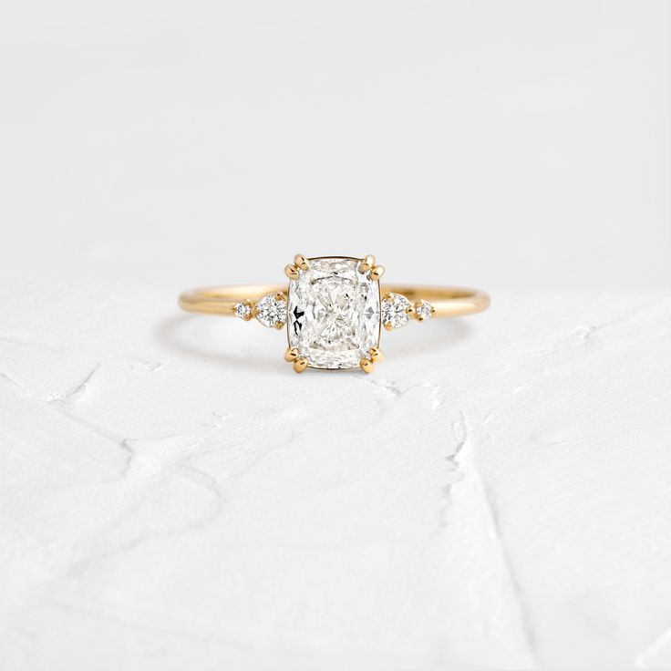 an engagement ring with a cushion cut diamond