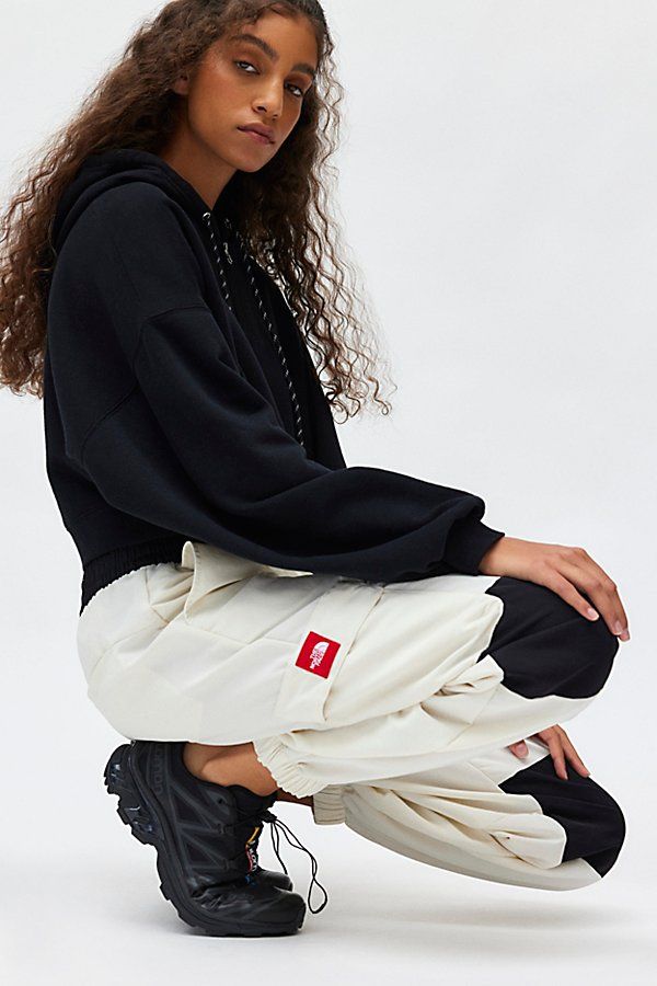 Sporty-cool The North Face track pant in a relaxed, jogger style. Crafter in a soft, fleeced knit featuring a mid-rise elasticated waistband, cargo-inspired pockets and cinched hems that crop at the ankle. Topped with classic TNF embroidery. Features The North Face HMLYN track pant Athleisure pant Soft & stretchy fleeced knit Mid-rise elasticated waistband with internal drawstring tie Cargo pockets & The North Face logos down leg Cinched hems Relaxed, slouchy fit Ankle length Easy pull-on style Sporty Cargo Pants With Ribbed Cuffs For Streetwear, Sporty Cotton Cargo Pants With Ribbed Cuffs, Trendy Sweats With Elastic Cuffs For Streetwear, Trendy Streetwear Sweats With Elastic Cuffs, Trendy Jogging Sweatpants With Ribbed Cuffs, Trendy Sweatpants With Ribbed Cuffs For Jogging, Baggy Sporty Sweats For Leisure, Sporty Baggy Sweats For Leisure, Sportswear Sweatpants With Cargo Pockets For Jogging