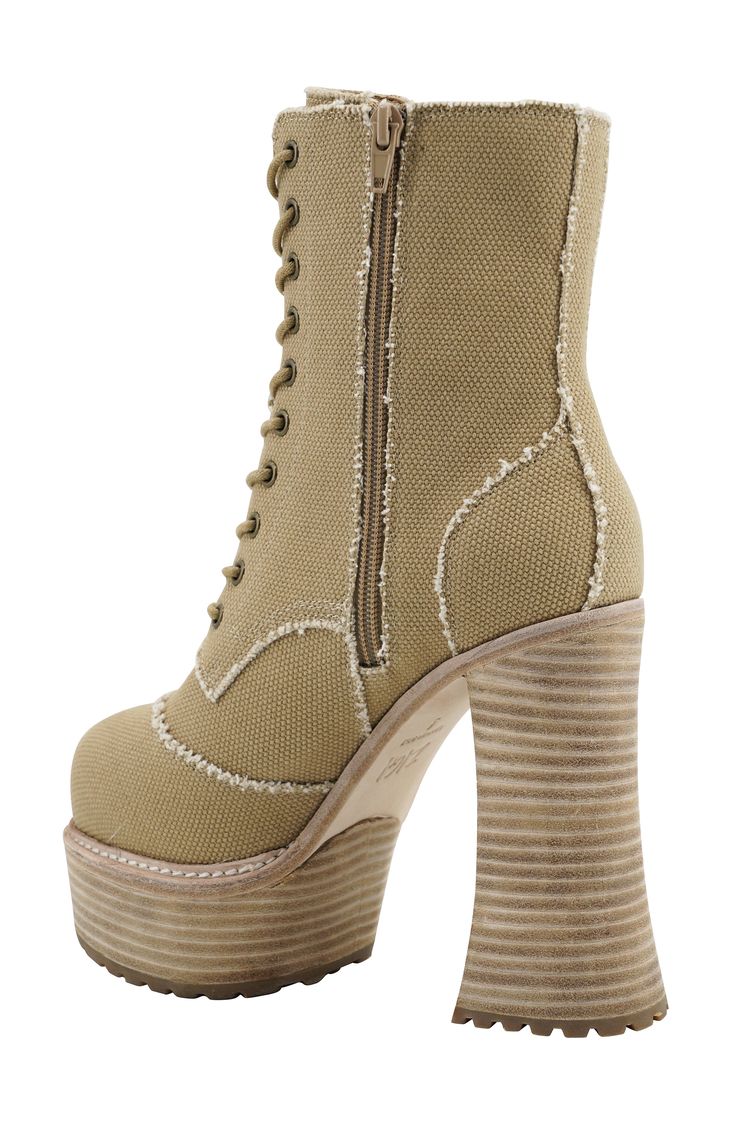 A dramatic platform puts an eye-catching retro spin on this outfit-defining lace-up bootie. 5 1/4" heel; 1 3/4" platform 6" shaft Textile upper and lining/leather sole Imported Bootie, Nordstrom, Top Brands, Size 7, Lace Up, Size 10, Great Deals, Luxury Fashion, Heels