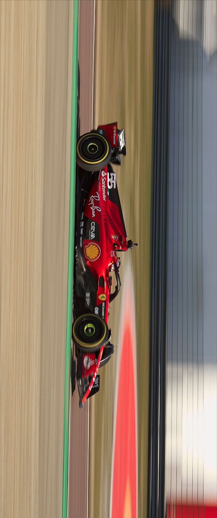 a red race car driving on a track