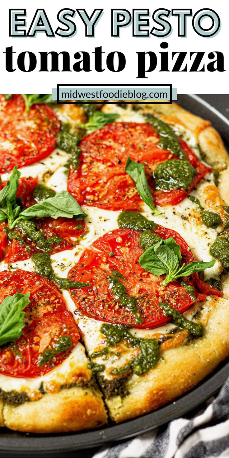 a homemade pesto pizza with tomatoes and basil