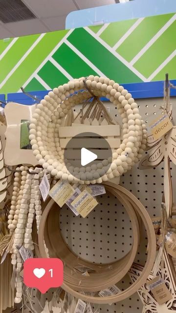 a display in a store filled with lots of wooden items and paper chains hanging from the ceiling