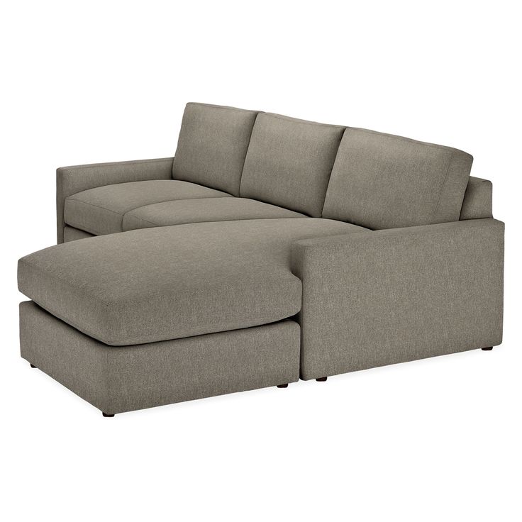 a large sectional couch sitting on top of a white floor