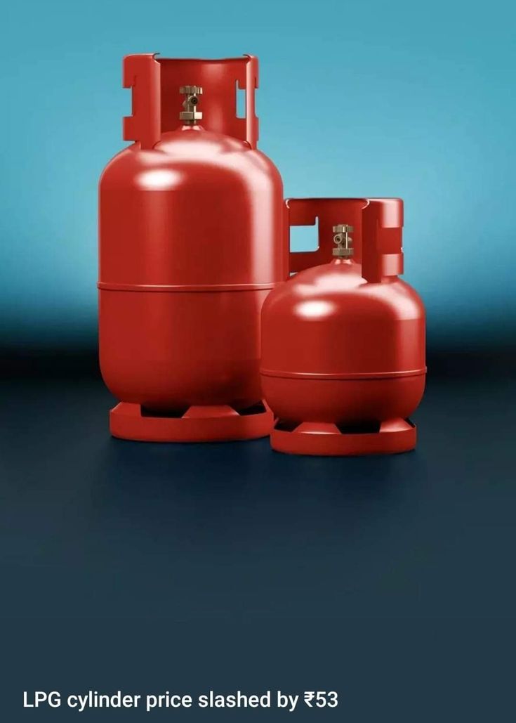 two red propane tanks sitting next to each other on a blue and black background