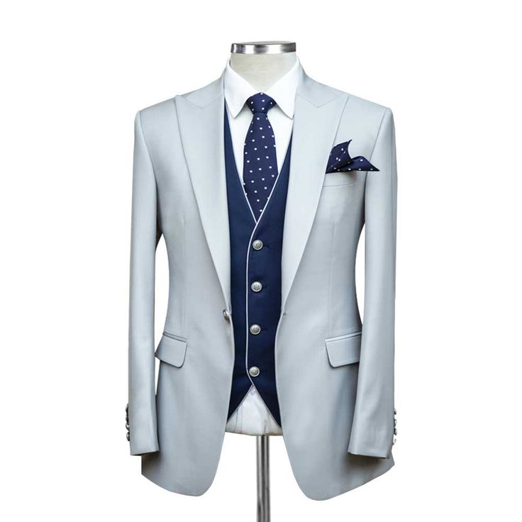 Introducing our Custom Grey Suit with Blue Vest, a masterpiece of timeless elegance and modern sophistication. Impeccably tailored from luxurious 120s fabric and lined with sumptuous silk, this suit exudes confidence and style. Luxury Fitted Single Breasted Three-piece Suit, Luxury Fitted Single-breasted Three-piece Suit, Elegant Blue Silk Blazer, Luxury Fitted Three-piece Suit With Suit Collar, Elegant Fitted Silk Blazer, Silk Tuxedo Suit For Business, Silk Suit With Lapel Collar For Office, Silk Office Suit With Lapel Collar, Luxury Single-button Sets With Notch Lapel