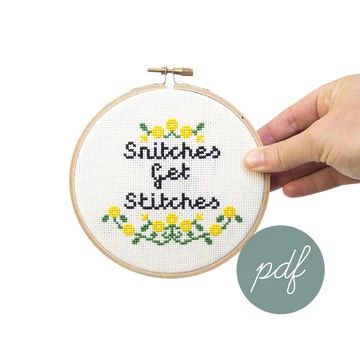 a hand is holding up a cross stitch kit with the words, sunshines and stitches