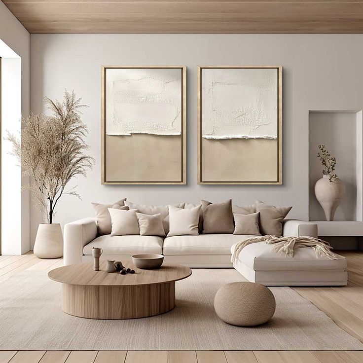 a living room with two paintings on the wall