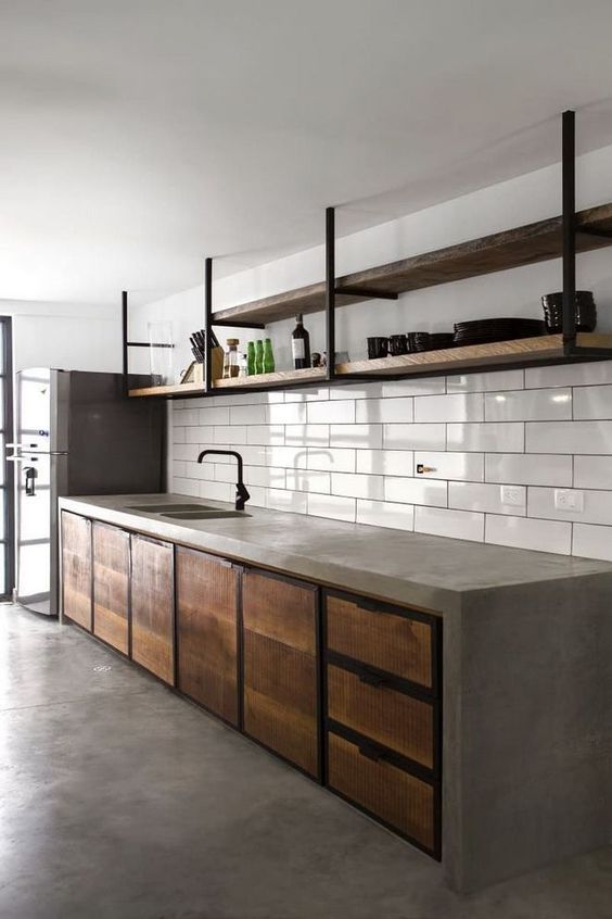 a kitchen with an oven, sink and shelves