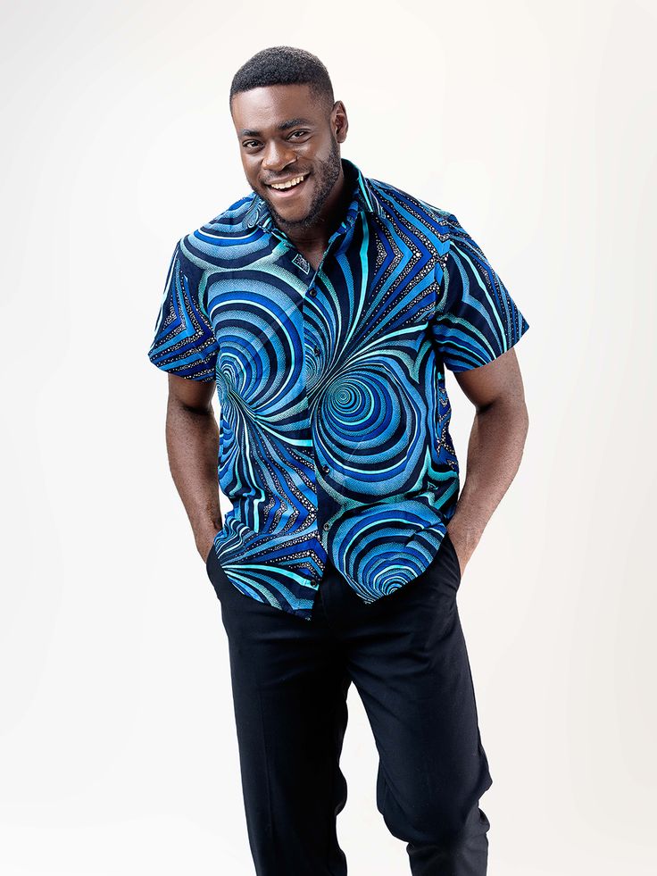 Our Mankon short Sleeve shirt is made of 100% cotton and features a relaxed, fitted silhouette. The African print on this lightweight shirt is subtle but bold, and the colors are beautiful. It's the perfect shirt for any occasion! Description 100% Cotton African Print Wax Short sleeves Front button Top length is 20 inches Made in Cameroon Fabric from Benin Care instructions hand wash cold iron on wrong side hang to dry do not bleach Mens Short Sleeve Shirt, Button Top, Fitted Silhouette, Perfect Shirt, African Print, Shoulder Sleeve, Short Sleeve Shirt, Sleeve Shirt, Care Instructions