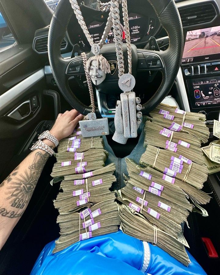 a car dashboard with stacks of money in the center