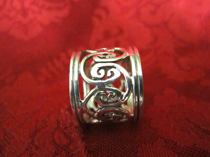 "The Excellence of Old Metalsmithing! Wire lace ring, handcrafted using the ancient tradition of filigree. Ring size 7 1/2. Weight 0.24 oz Length 5/8 of an inch. Another example of finely fabricated traditional wire work. Oxidized to give the scroll design that antique look against the shimmer of high polish finish. Seamless, which means ring can not be sized without destroying the continuity of the design. So each ring has to be built from \"the ground up\". THE AESTHETICS OF AFRICAN \"BEAUTY\" Traditional Round Jewelry With Decorative Band, Traditional Jewelry Ring With Decorative Band, Silver Filigree Ring With Intricate Design For Ceremonial Occasion, Ornate Ceremonial Rings With Decorative Band, Traditional Rings With Decorative Band, Ornate Jewelry With Decorative Band As Gift, Ornate Jewelry With Decorative Band For Gift, Traditional Engraved Ring With Decorative Band, Traditional Rings With Decorative Band As Gift