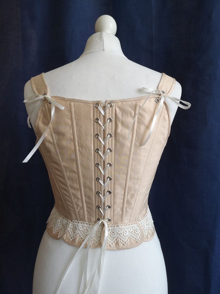 This silk corset is made after original 18th century paterns and has a strong waist reduction effect. It makes a specific Rococo shape with prominent bust and small waist, most feminine and fashionable acording to the Madame de Pompadour epoch standarts. It can be worn for the 17th - 18th century ball as a proper undergarnment of the epoch, being a part of the full costume, or become a bodice for the Renaissance, Baroque or Rococo inspired fantasy outfit. The corset on listing pictures is made o Elegant Costume Corset With Boning, Elegant Boning Corset For Costume, Elegant Boned Corset For Costume, Elegant Underbust Corset With Lace Trim, Victorian Bodice With Corset Back For Wedding, Victorian Overbust Wedding Bodice, Victorian Wedding Bodice With Corset Back, Historical Underbust Corset Dress For Wedding, Wedding Underbust Corset Dress With Historical Design