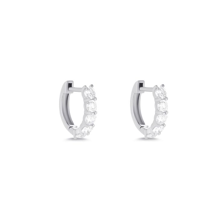 Design Our classic huggie style with extra large diamonds. To be worn when you're feelin' extra. Details & Dimensions - 0.70 carats (pair), 0.35 carats (single)- Exterior Measurements: 11mm width, 9.5mm height- Interior Measurements: 6.5mm width, 7mm height Classic Huggie Earrings With Diamond Accents, Classic Hoop Earrings With Single Cut Diamonds, Classic Huggie Earrings With Diamond Accents For Everyday, Classic Everyday Luxury Huggie Earrings With Diamond Accents, Classic Brilliant Cut Huggie Earrings For Everyday, Classic Formal Huggie Earrings With Single Cut Diamonds, Classic Small Hoop Diamond Earrings For Everyday Luxury, Everyday Classic Brilliant Cut Huggie Earrings, Classic Everyday Luxury Diamond Earrings With Single Cut