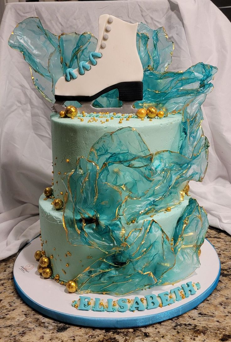 a birthday cake with ice skates on top